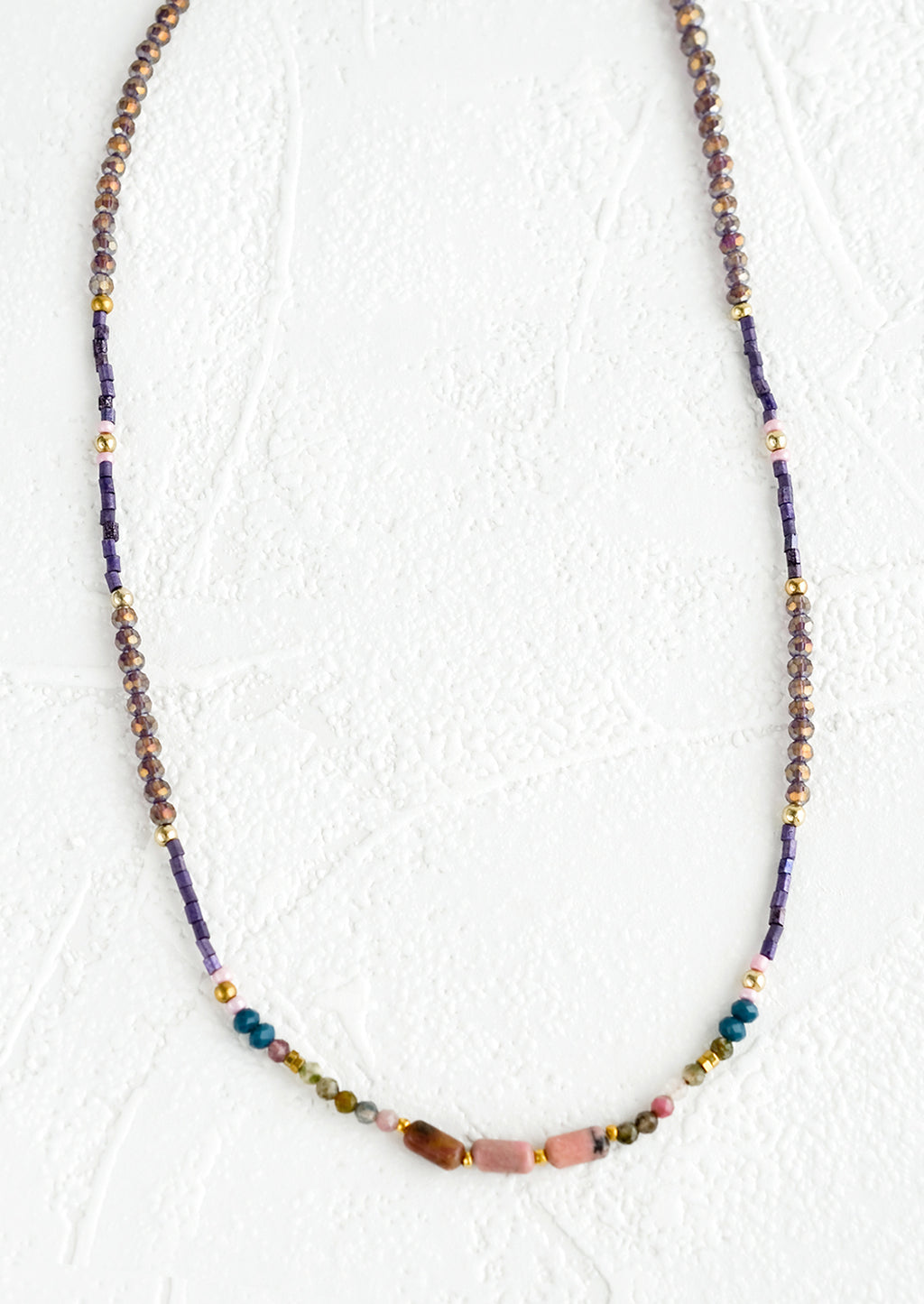 1: Beaded necklace with varied glass and gemstone beads.