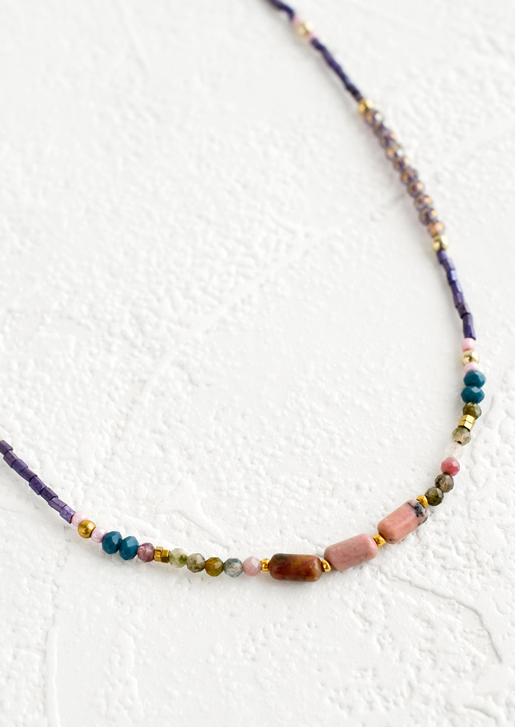 2: Beaded necklace with varied glass and gemstone beads.