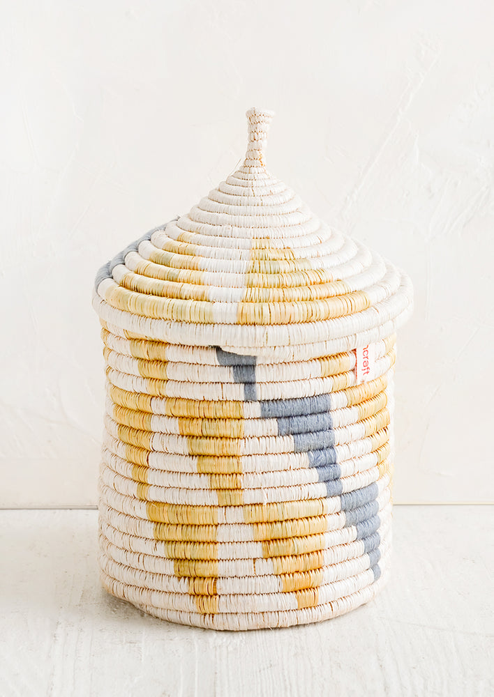 Medium [$68.00]: A medium woven basket with gourd-style lid in white with natural and slate grey triangle pattern.
