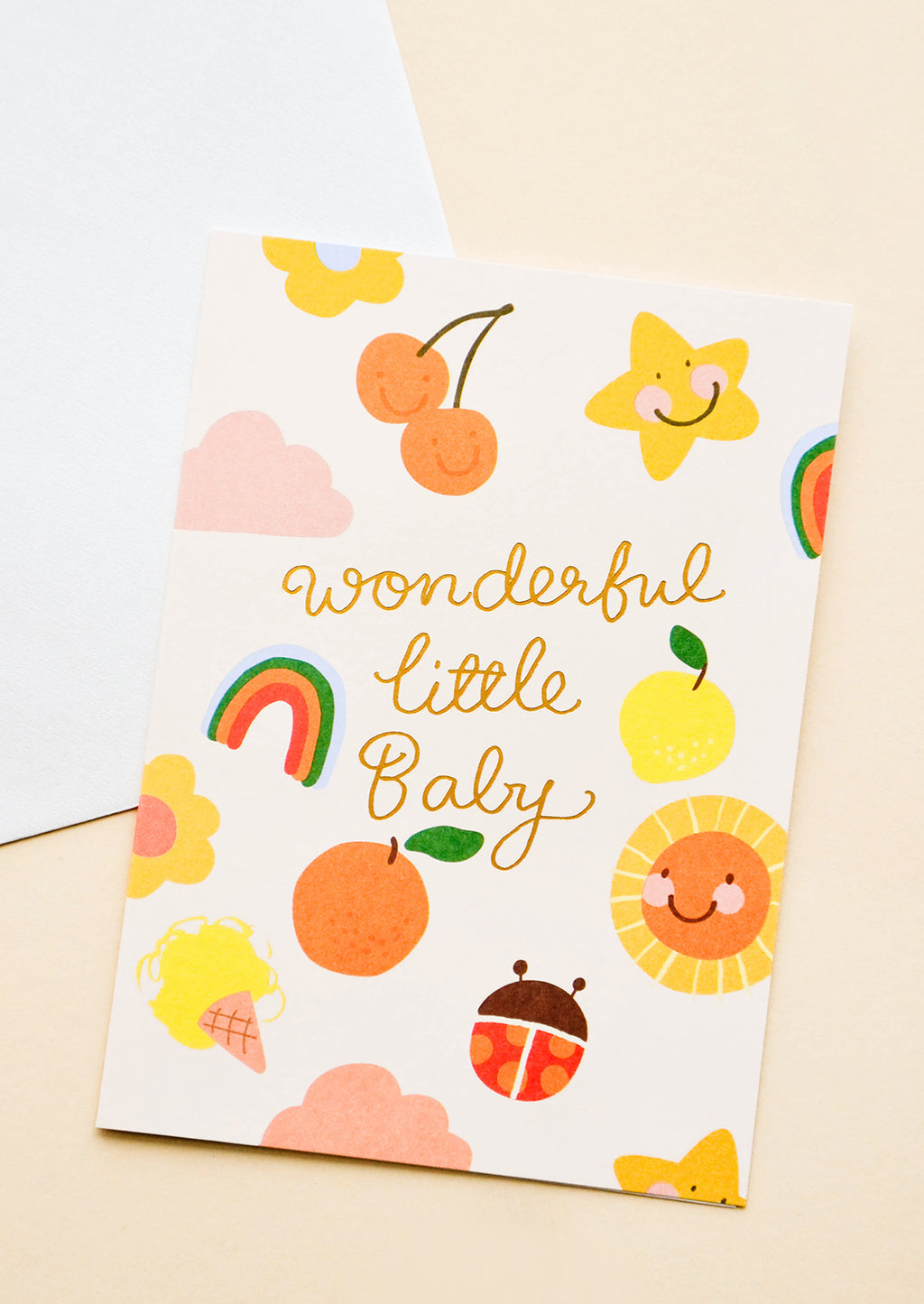 1: Greeting card with illustrated shapes and "wonderful little baby" written in gold foil.