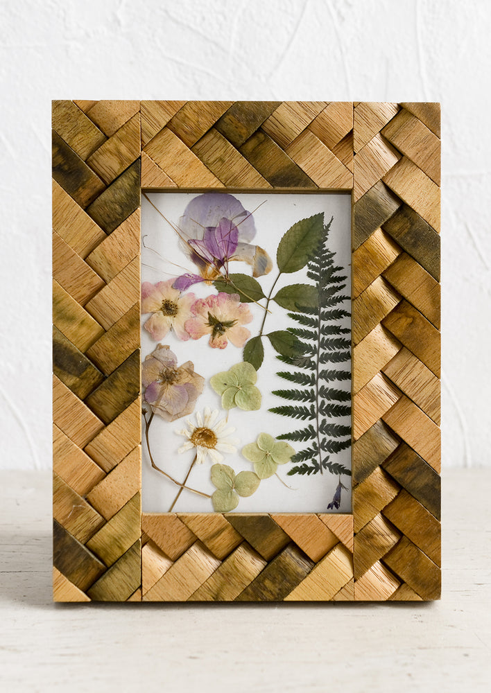1: A wooden picture frame with basketweave texture.