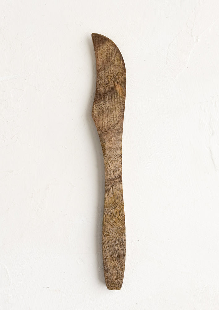 A simple wooden butter knife.