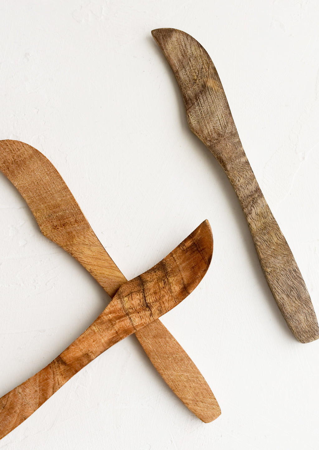 3: Wooden butter knives showing slightly varied wood colors.