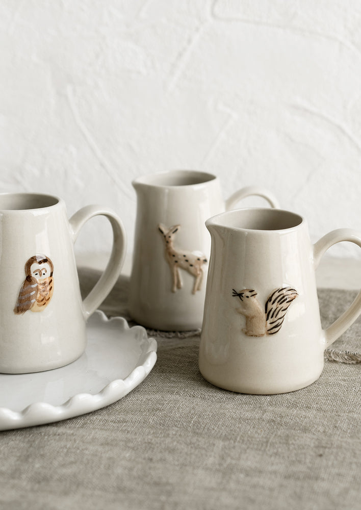 2: Ceramic creamer pitchers with assorted woodland creature motifs.