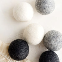 Grey Multi: A set of six wool dryer balls in various shades of grey.