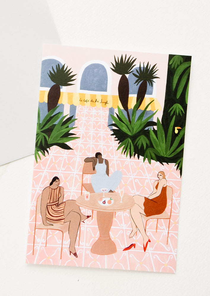 1: Oversized greeting card picturing women sitting at an outdoor cafe