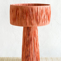 Terracotta Peach: A table lamp wrapped in peach raffia.