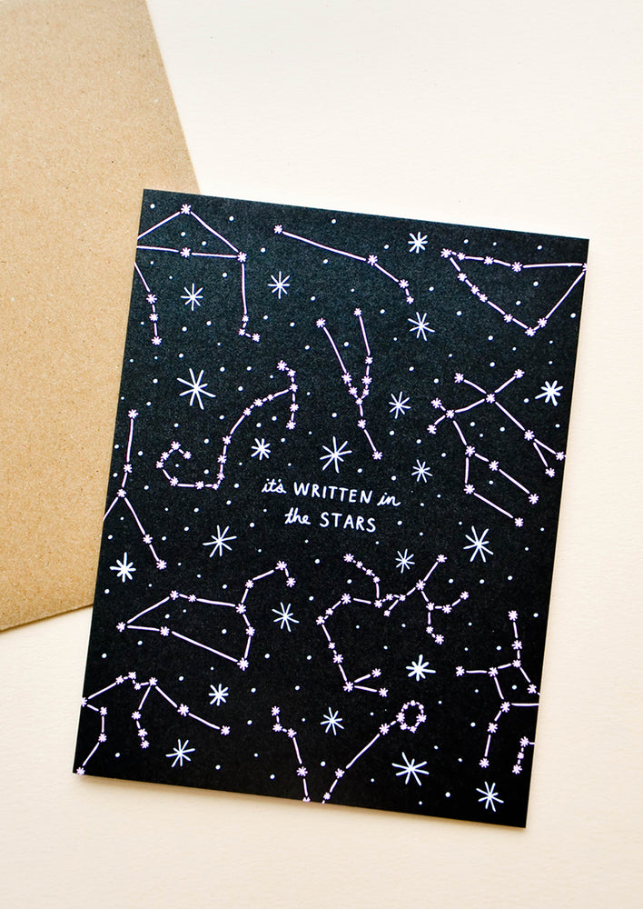 1: Greeting card with allover constellation print and text reading "It's written in the stars"