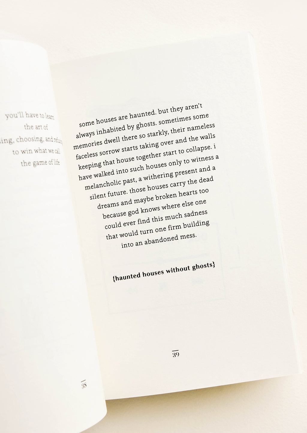 4: Inside pages of a softcover poetry book featuring a poem titled "Haunted Houses Without Ghosts"