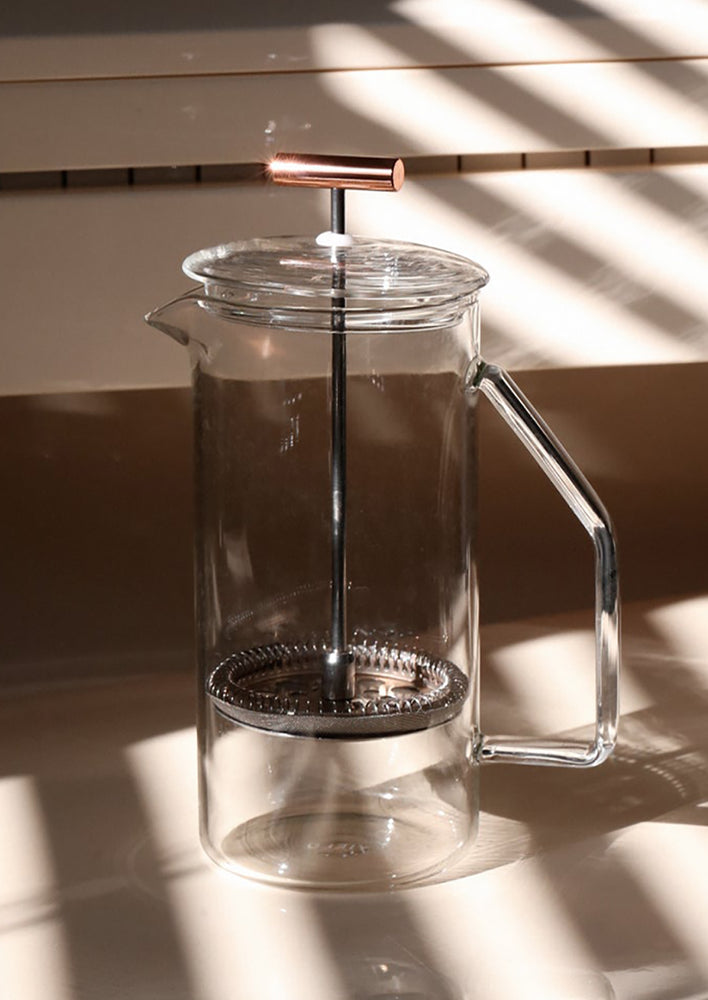 A french press in clear glass.