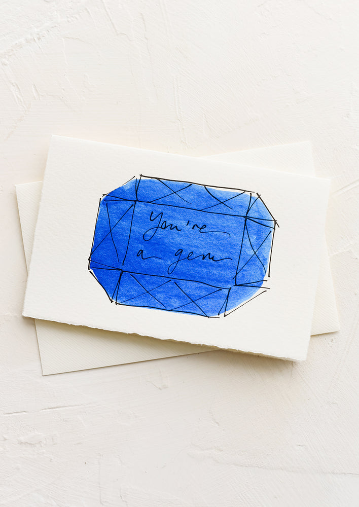 1: A greeting card with illustration of blue gemstone and text reading "you're a gem".