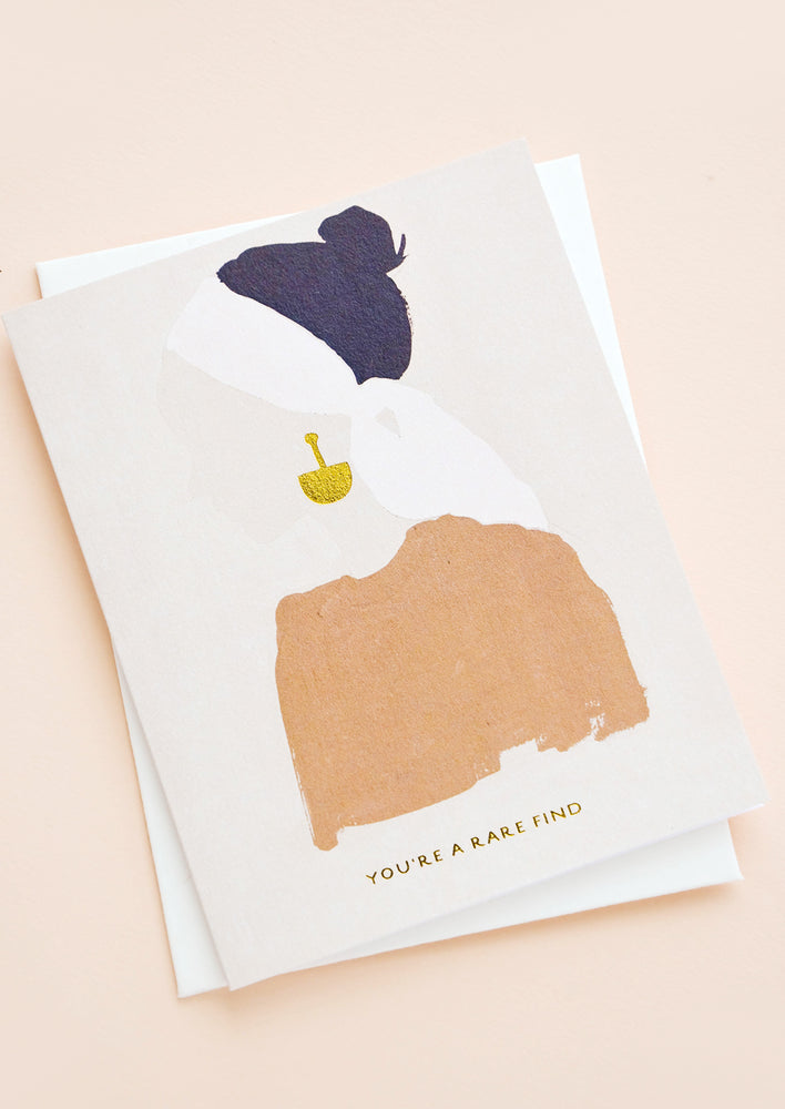 1: Greeting card with silhouetted image of a woman wearing gold earrings, gold text below reads "You're A Rare Find"