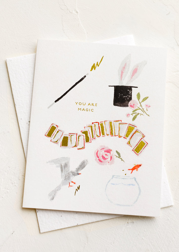 A greeting card with images of magic wand and bunny in a hat with text reading "You are magic".