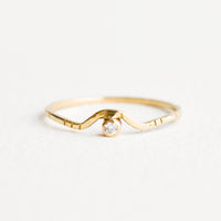 1: Yellow gold ring with etched decorative lines and a diamond set into an arched front.