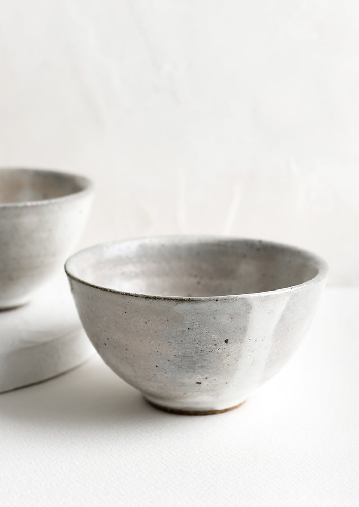 1: A ceramic rice bowl in rustic grey glaze.