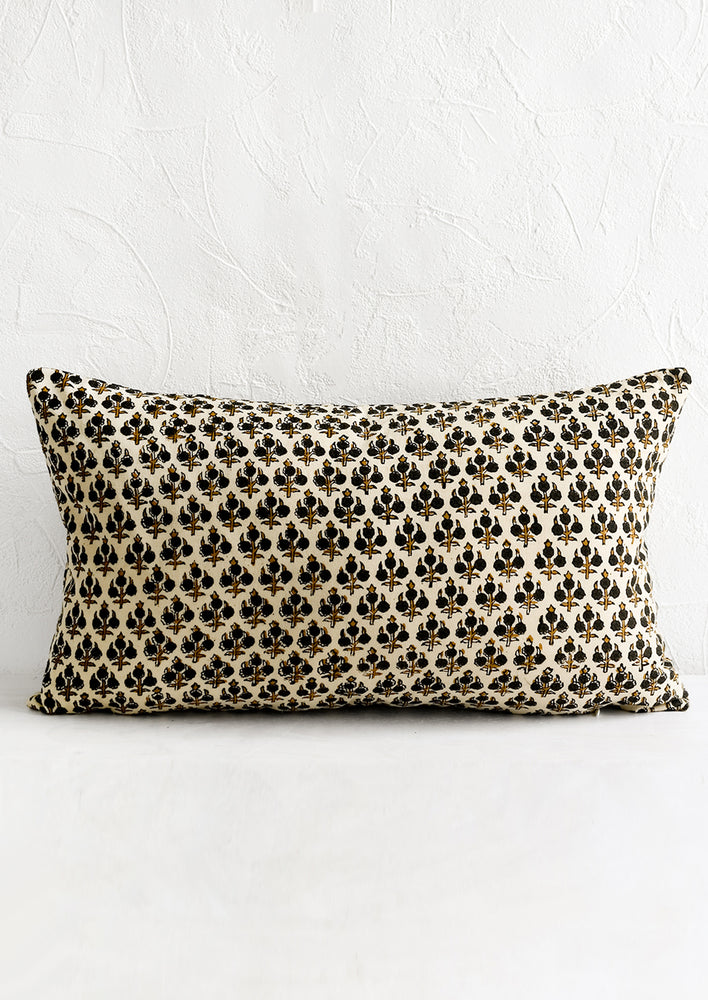1: A block printed lumbar pillow.